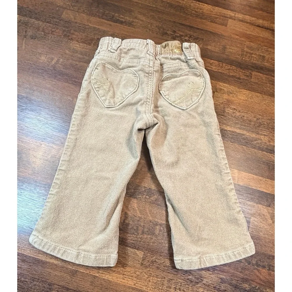 Vintage girls tan corduroy pants with glitter and heart pockets.  Sz 18 months.
